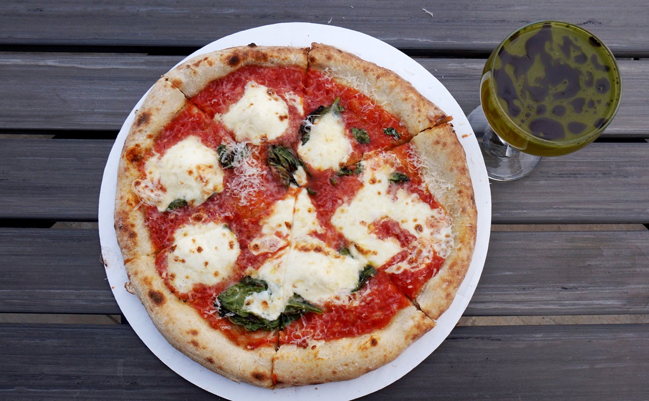 A Margherita pizza from Sprezzatura with a crazy cocktail from the bar at Rocker Spirits.