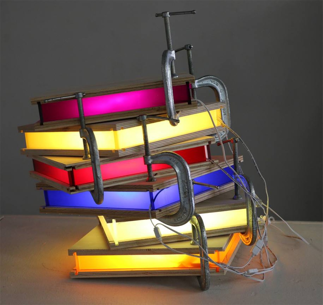 Craig Robb, "A Fractious Embrace," wood, acrylic, LED lights, C-clamps, 2017.