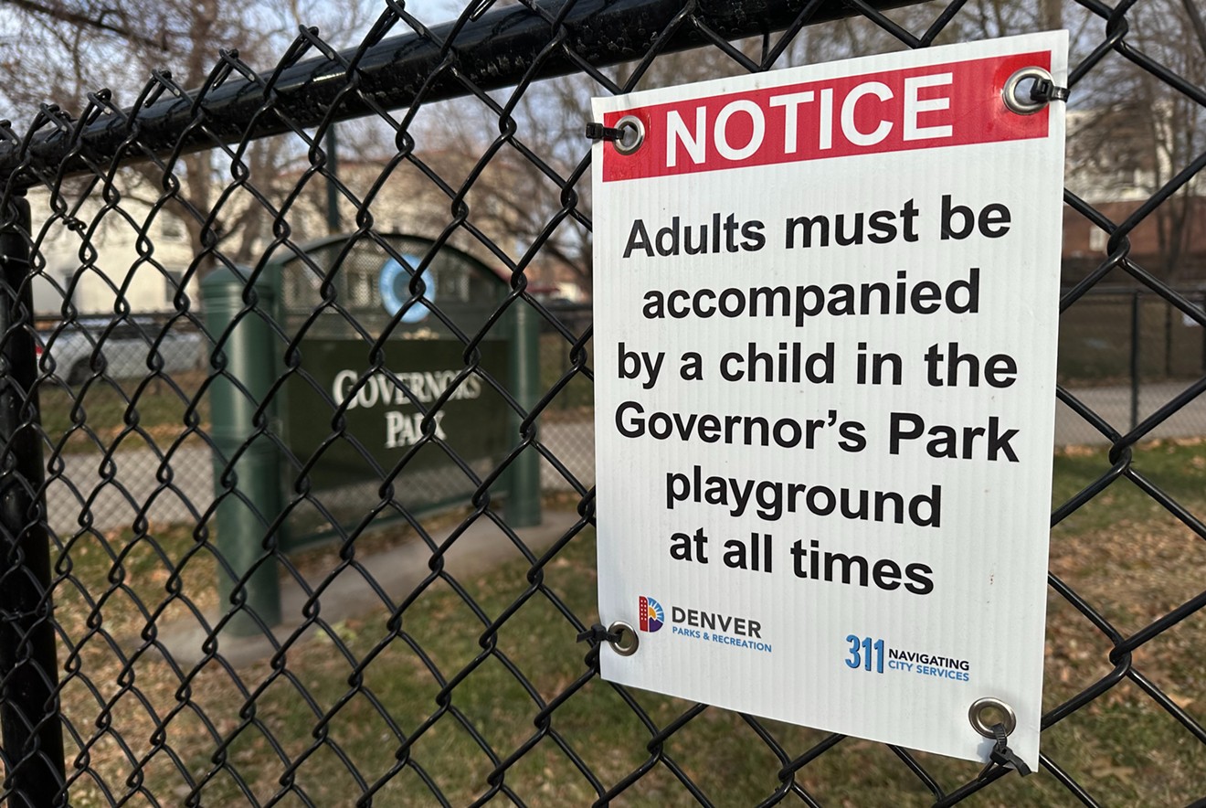 A sign at Governor's Park warns adults to stay away from the playground unless accompanied by a child.