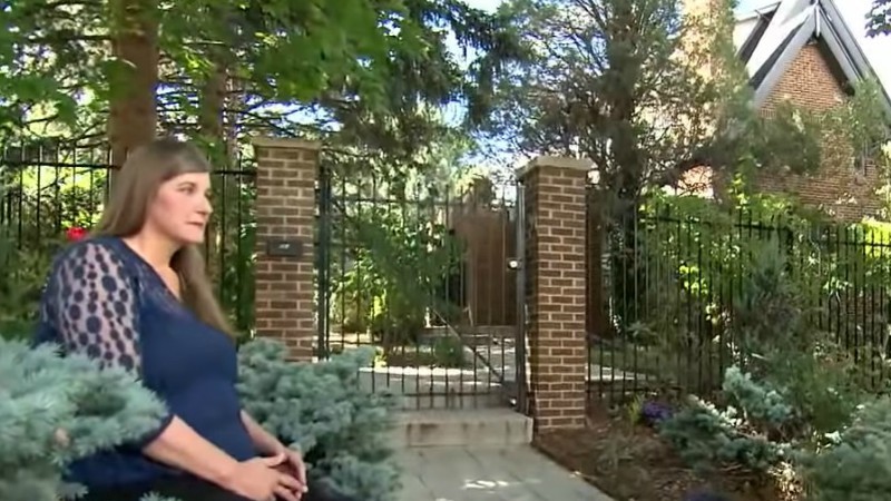 Carol Schuller Milner outside the former Ramsey family home in Boulder, where she and her husband, Tim, currently live.