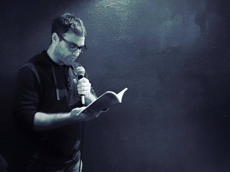 Denver writer Michael Pool reads at a recent Noir at the Bar event.