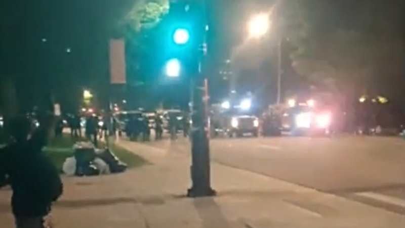 Denver police begin to clear out the last of the protesters early today, as seen in this screen capture from a video by Dylan Beresford.