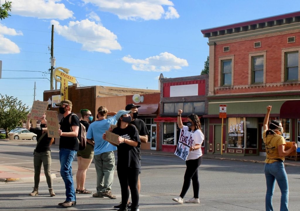 Protesters marching in downtown Alamosa on June 4, moments before the shooting. James Marshall is second from left.
