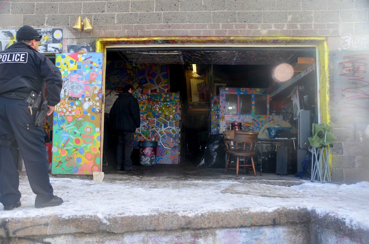 Denver police oversee the artists ousted from Rhinoceropolis.
