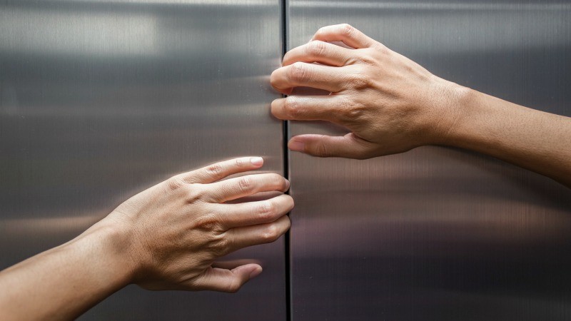 elevator.hands.getty.jpg