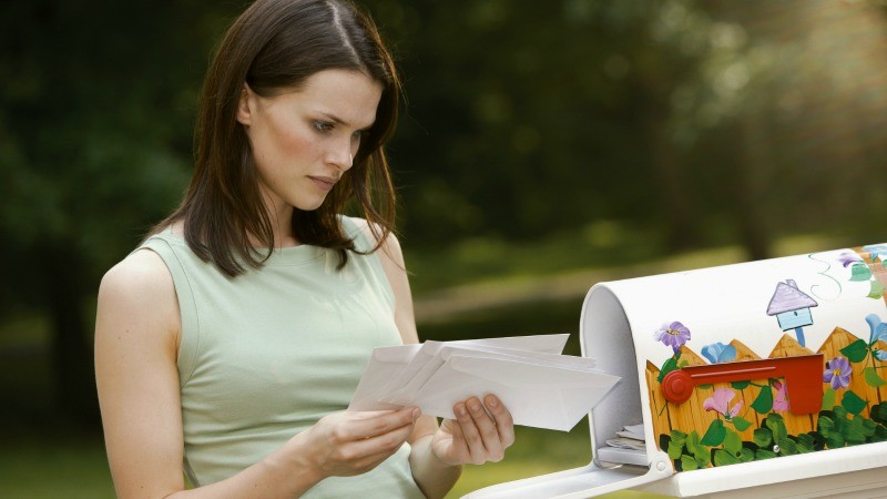 woman.getting.mail.getty.images.jpg
