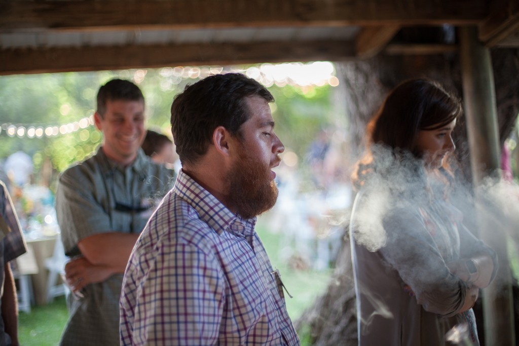 Patrons of a private cannabis consumption event in Longmont wait for a free dab.
