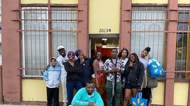Youth and staff outside the Make a Chess Move main office in East Denver.