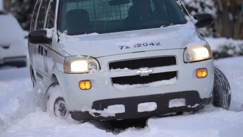 A postal vehicle struggling in the snow on a side street last week.