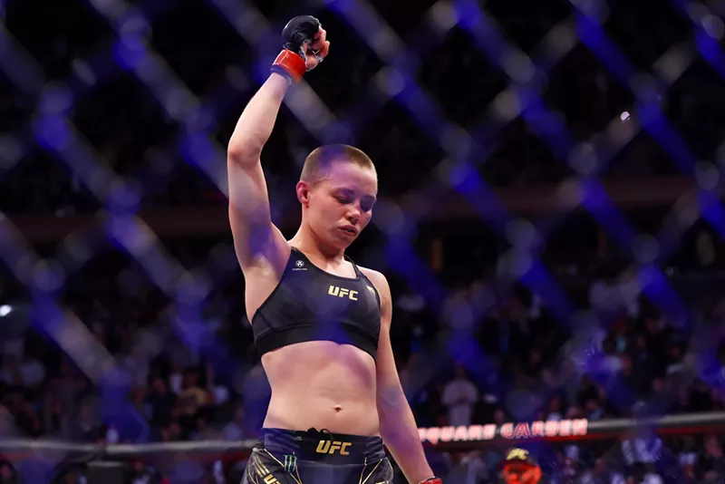 Image: MMA fighter with fist up in cage