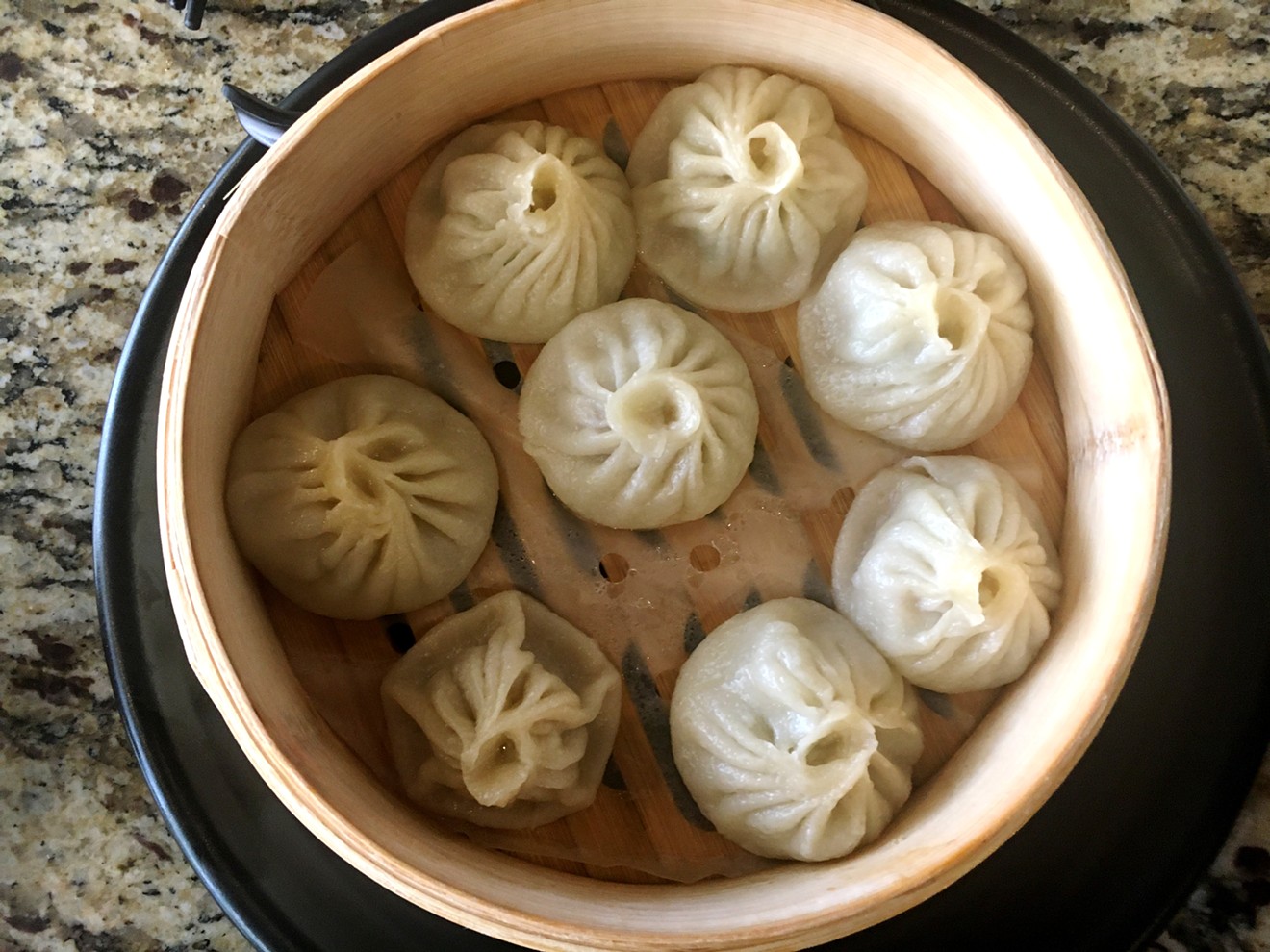 The delicate pleats are a sign that these xiaolongbao are handmade.