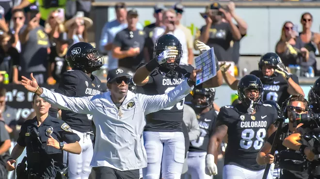 Deion sanders coaches football on sidelines