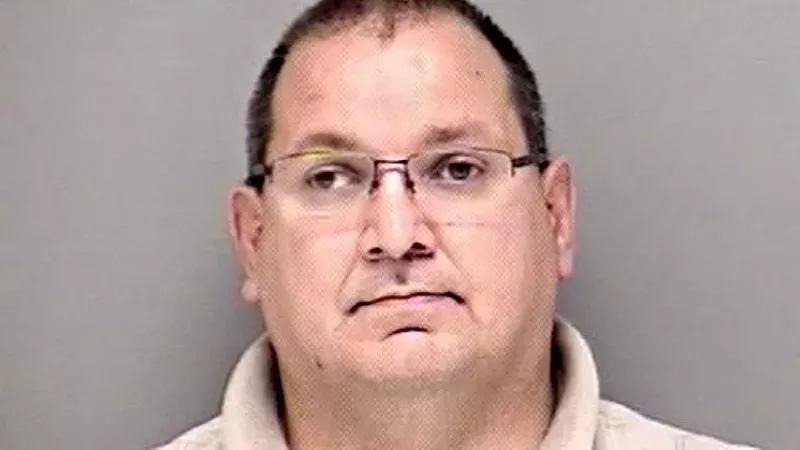 Image: The booking photo of former Westminster police officer Curtis Arganbright.