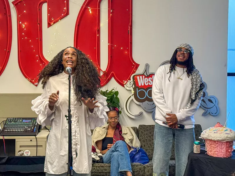 Image: Dominique Christina and DNA Picasso performing in the Denver Westword office