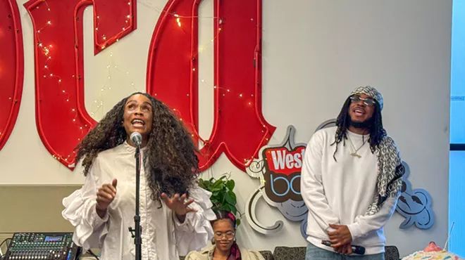 Dominique Christina and DNA Picasso performing in the Denver Westword office