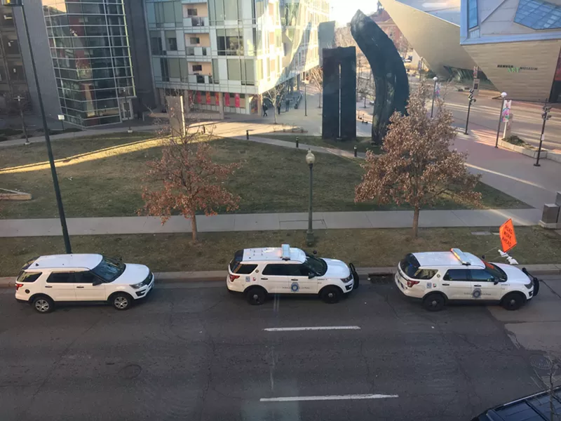 Image: Police parked outside the Denver Art Museum on Sunday afternoon.