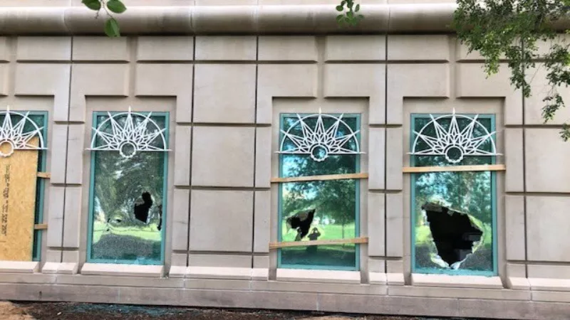 Image: A photo tweeted by Aurora Mayor Mike Coffman showing damage done to a city building during a July 25 rally in support of the late Elijah McClain.