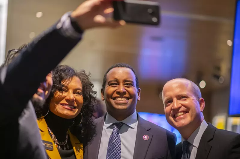 Image: Dispensary owner Wanda James (left) and Colorado Congressman Joe Neguse (middle) celebrated on November 8.
