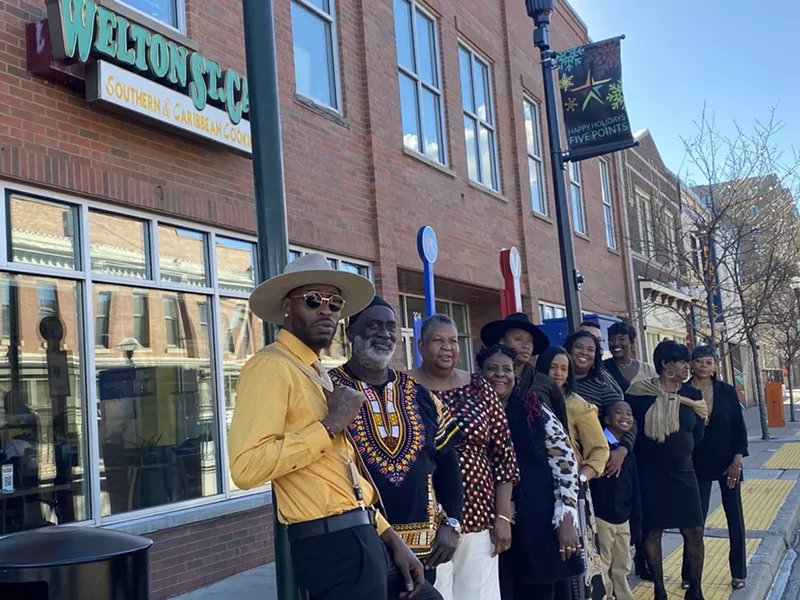 Image: Members of the Dickerson family in front of the location that will close March 12.