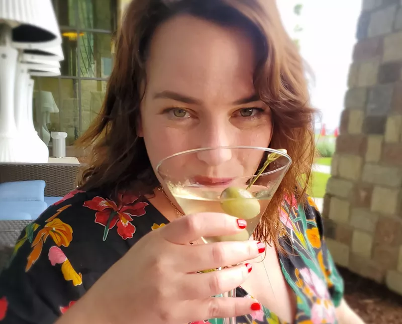 Image: woman sipping martini