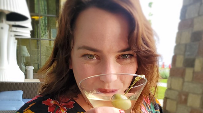 woman sipping martini