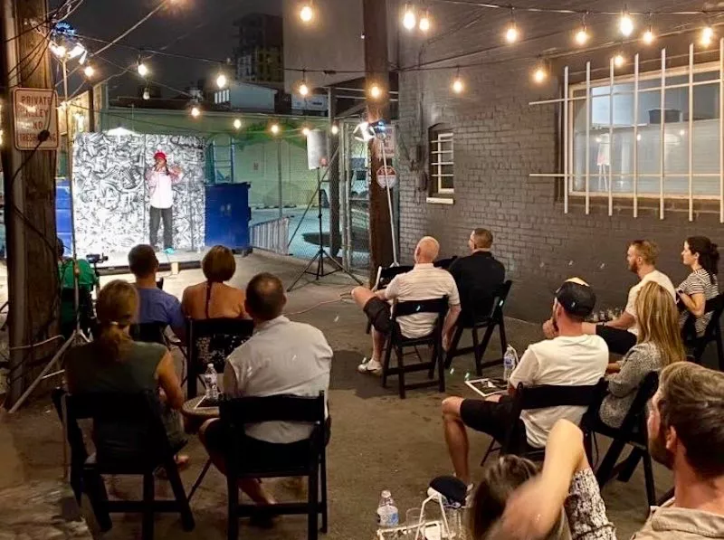 Image: Derrick Rush headlining an outdoor show at the Denver Comedy Lounge.