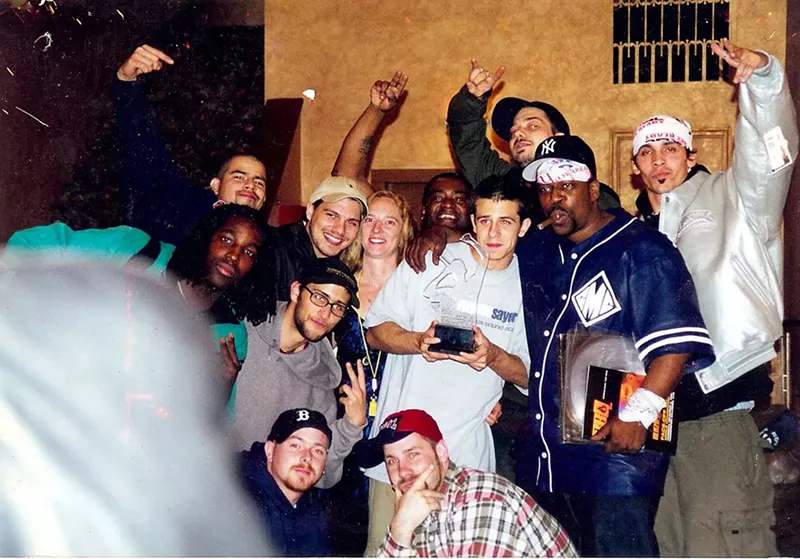 Image: Michael "Eyedea" Larson (middle, white shirt) with some of the Rhymesayers crew.