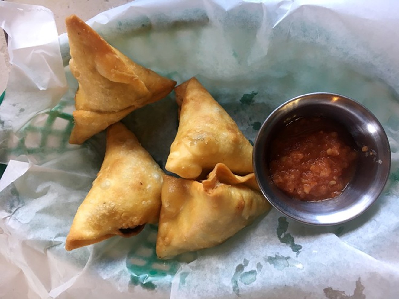 Samosas from the African Grill & Bar come with the akwaaba plate.