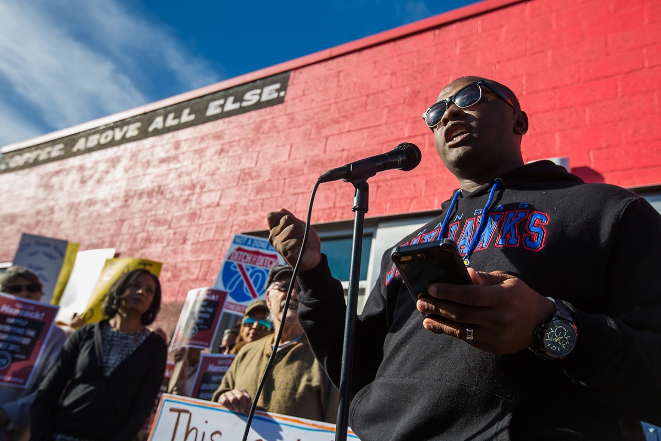 Tay Anderson speaks at a protest in front of Ink! Coffee in Five Points on November 25, 2017.