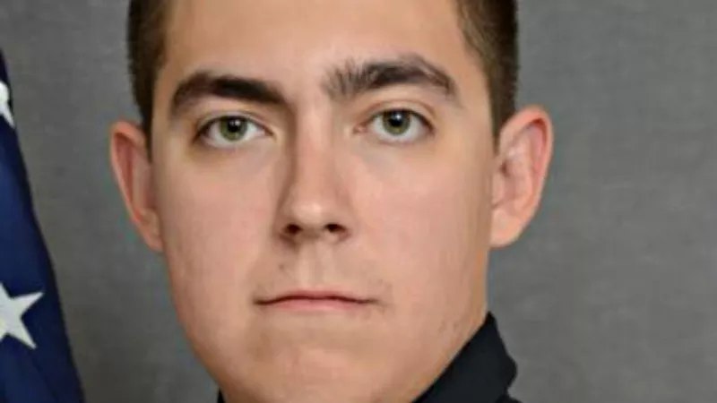 Image: John Reinhart's photo during his time as a Commerce City police officer.
