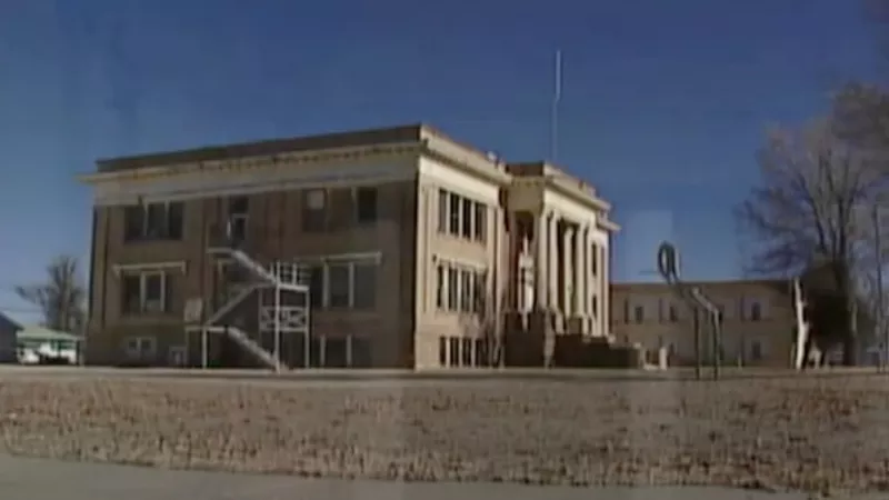 Image: A look at the high school in Bent County, where there's a wide disparity in COVID-19 death totals.