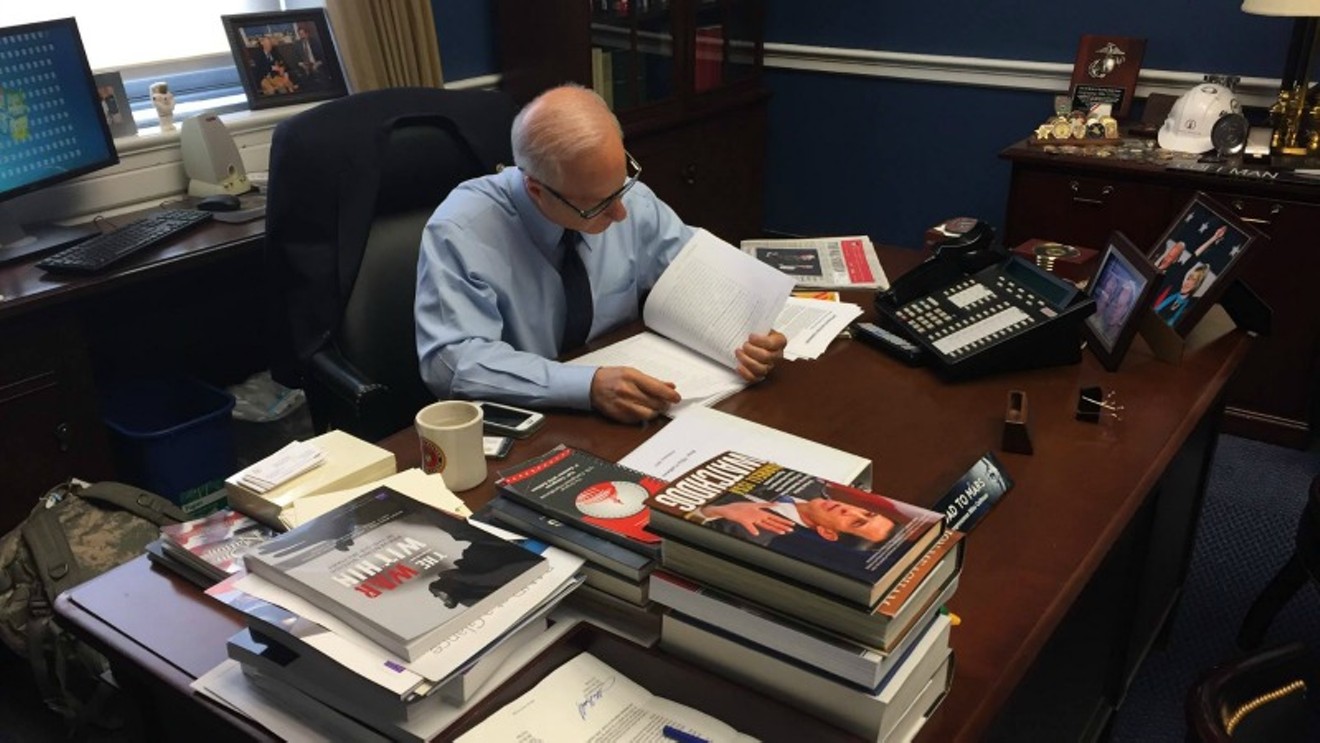 The caption that accompanies this photo on Representative Mike Coffman's Facebook page reads, "Got back to DC and I'm closely reading #healthcare bill text to make sure it is in the best interest of #CO06 residents."