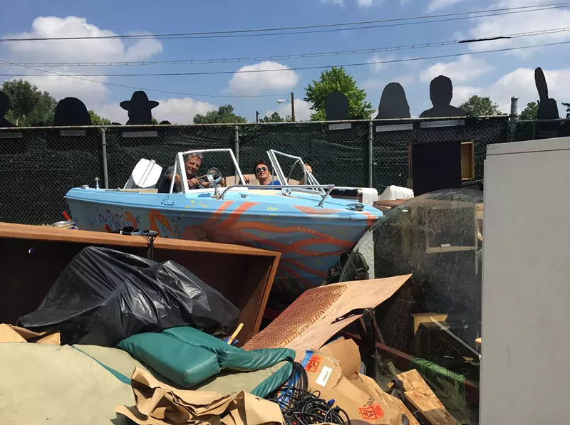 Image: Jonny Barber and friend amid the flood flotsam and jetsam.