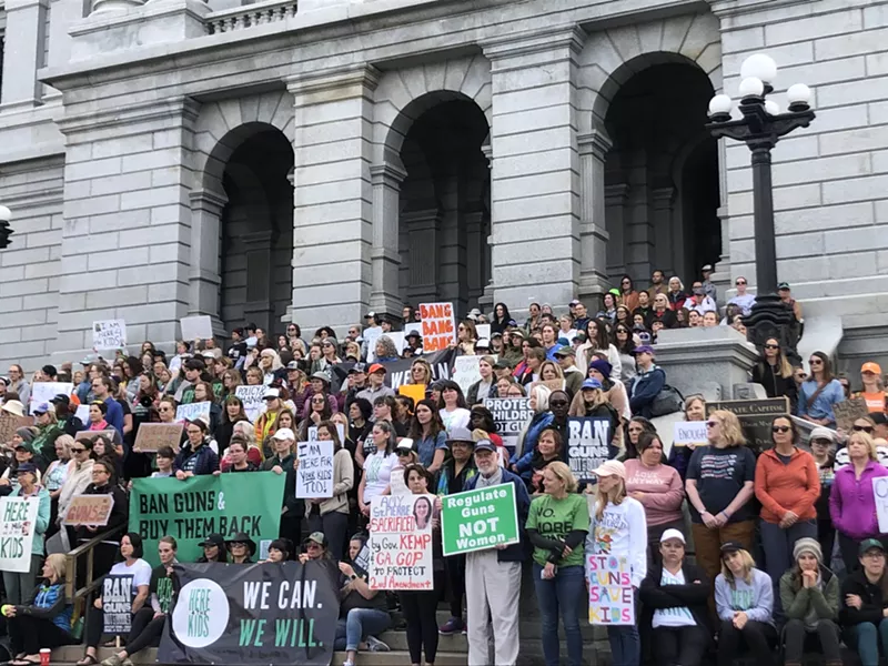 Image: Here4TheKids protesters stand on the steps of Colorado State Capitol to demand Governor Jared Polis sign an executive order banning guns.