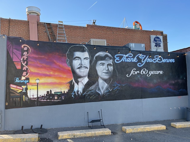 A mural at Pete's Satire features Elizabeth and Pete Contos.