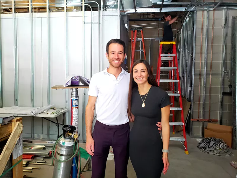 Image: Whole Sol owners Phil Dumontet and Alexa Squillaro overseeing the construction of their downtown shop.