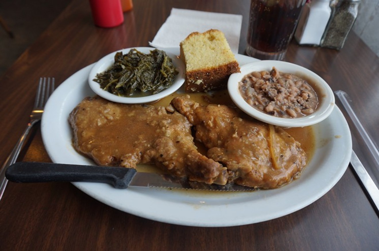 Pork chops in gravy with collards, black-eyed peas ad cornbread at the Welton Street Cafe.