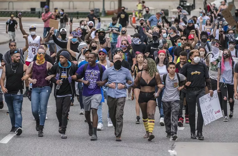 Image: Neil Yarbrough joined a line of protesters at the front of the May 30 march.