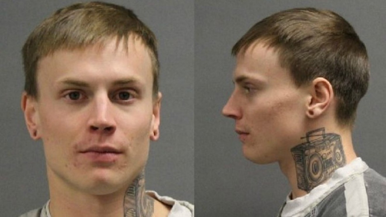 The booking photo of Brandon Johnson released following his arrest for Mark Largay's 2015 death. Note the distinctive boombox tattoo on his neck.