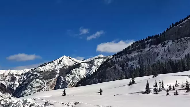 ski slop under blue sky