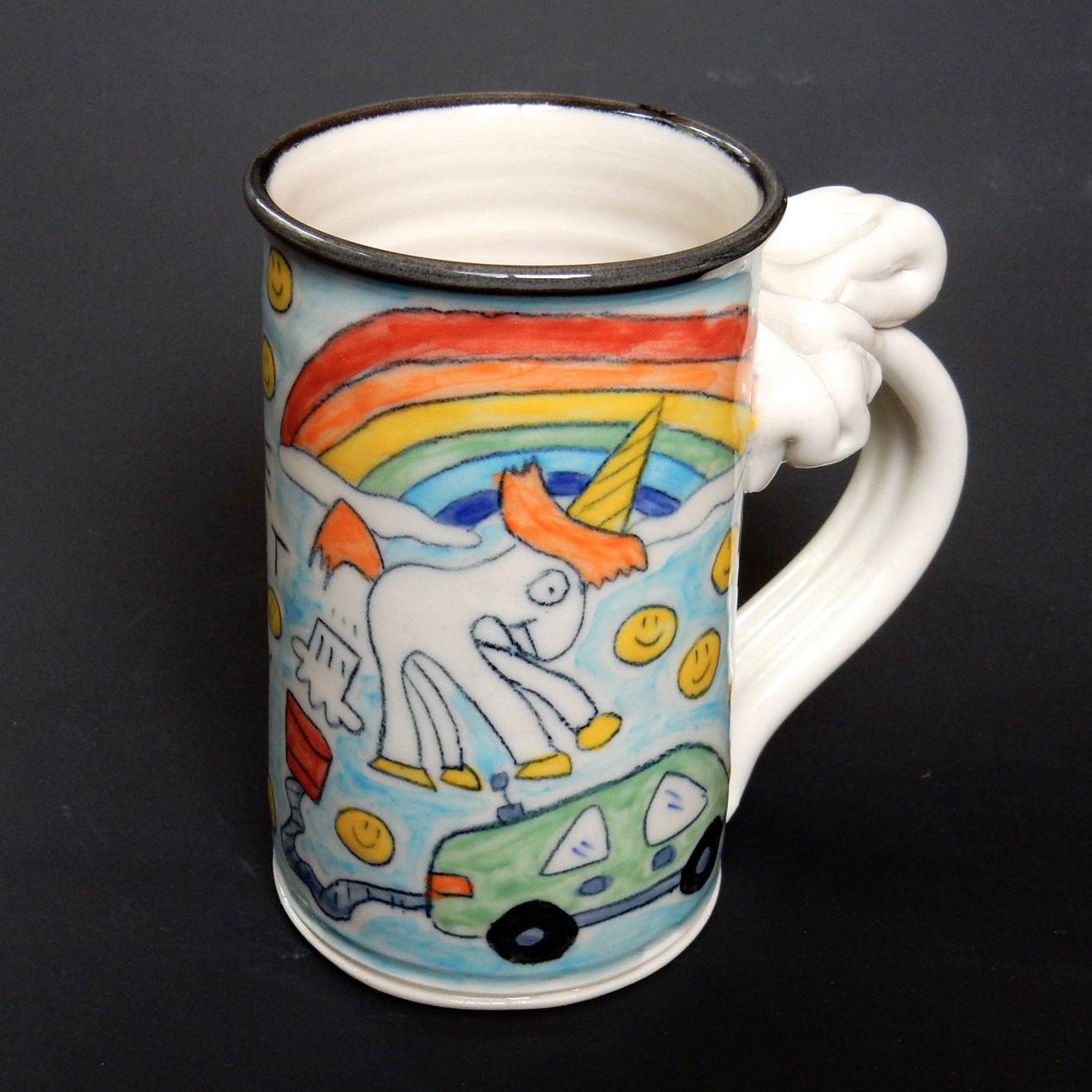 Tom Edwards's mug with the farting unicorn image that wound up in Elon Musk's cars.