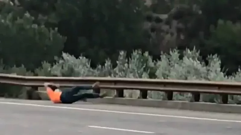 Image: Rifle's Allan George falling to the ground after being shot in the back, as seen in a video on view below.