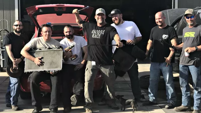 Image: Willie B, center, and members of his Cars for Christmas crew.