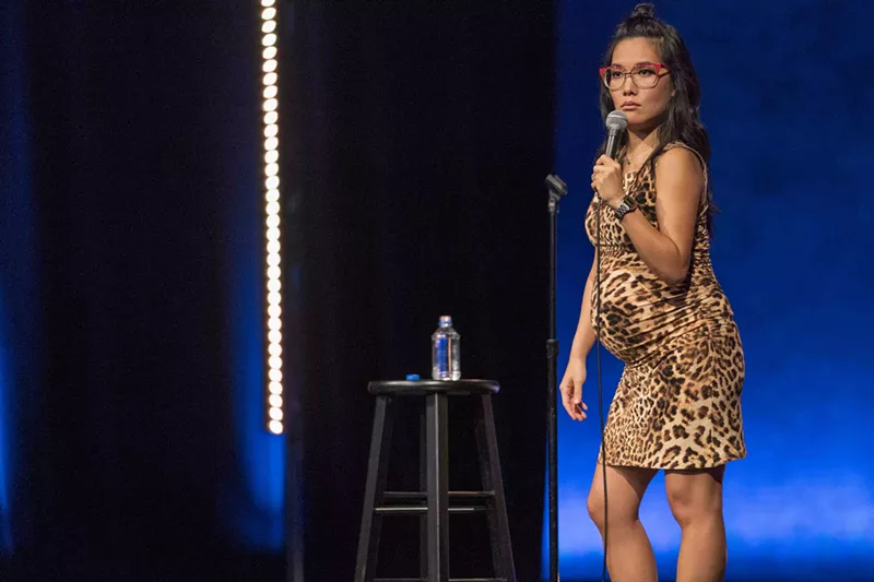 Image: In Hard Knock Wife, her second Netflix special, Ali Wong wears a skintight, animal-print dress stretched over her baby bump that silently explodes the borders between maternal and sexy, feminine and funny, selfless and attention-seeking.