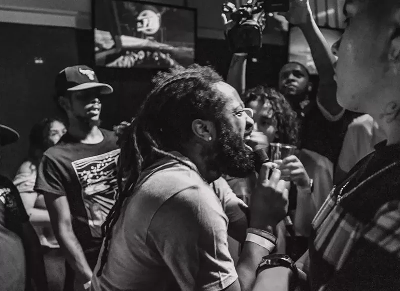 Image: rapper at an open mic