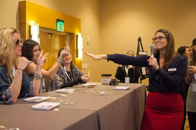 Image: Women Grow fonder Jane West (right) leads a joint rolling class at the Women Grow Leadership Summit February 2.