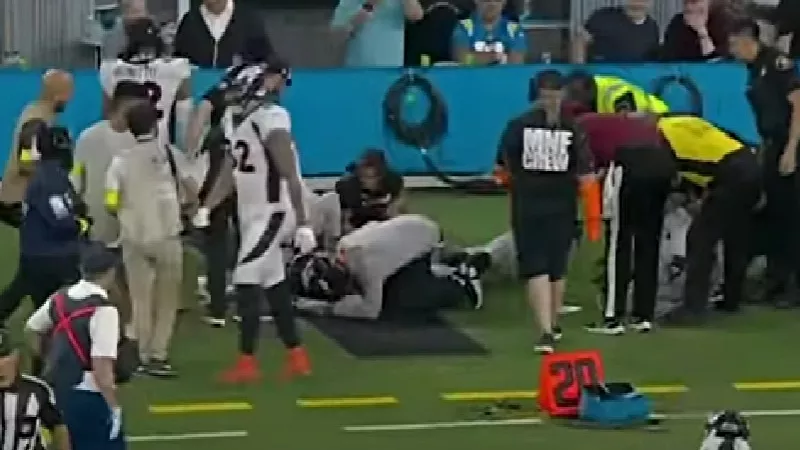 Image: Medical staff huddling around Aaron Patrick, center, after his sideline injury on October 17.