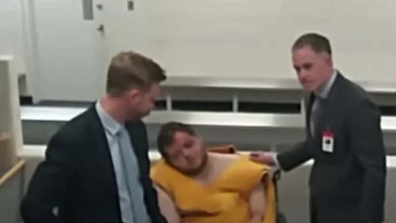 Image: The Club Q shooting suspect seemed barely conscious during a court appearance.