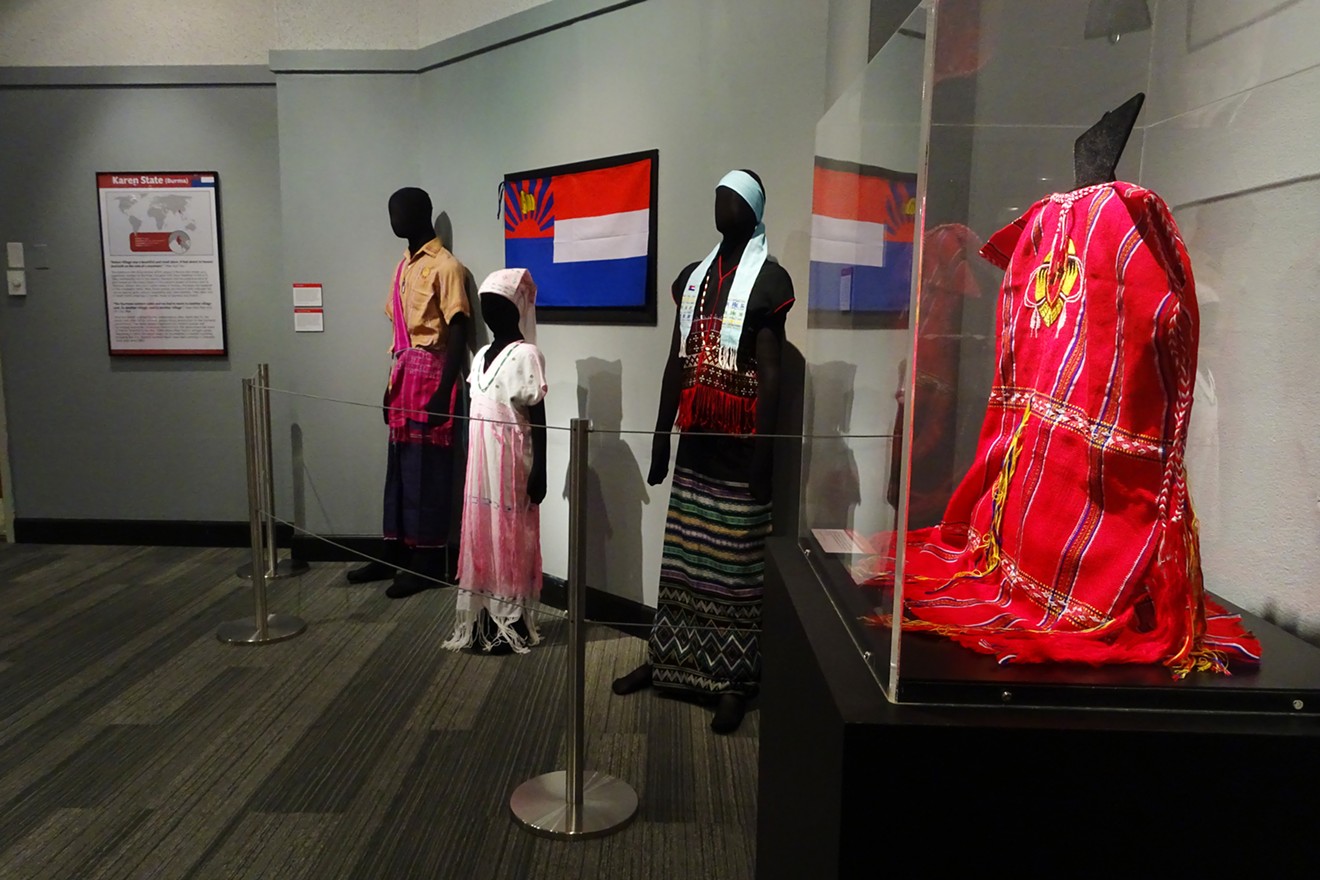 Traditional clothing of the Karen people, an ethnic minority persecuted in Burma, at the Aurora History Museum; Aurora has welcomed hundreds of Burmese refugees, including Karen families.