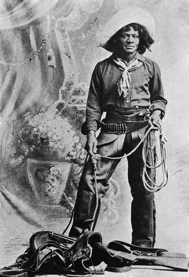 Image: A black and white photo of a Black cowboy